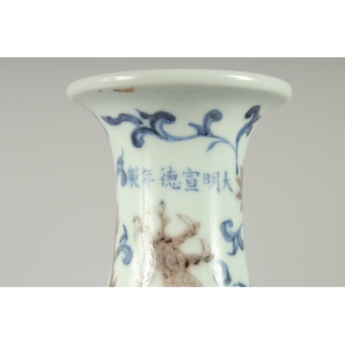 107 - A CHINESE UNDERGLAZE RED, BLUE AND WHITE DRAGON AND PHOENIX YUHUCHUNPING VASE, on a fitted hardwood ... 