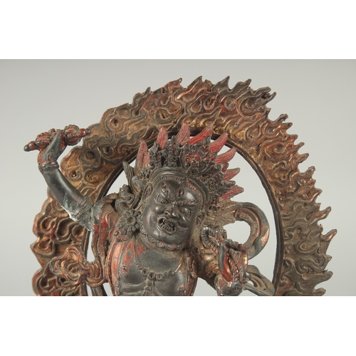 124 - A TIBETAN BRONZE DEITY, with detachable halo.