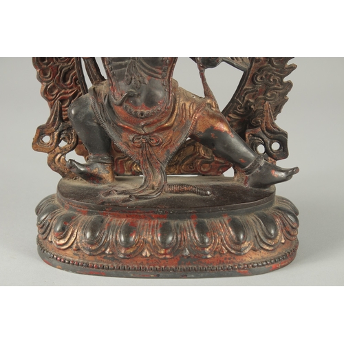 124 - A TIBETAN BRONZE DEITY, with detachable halo.