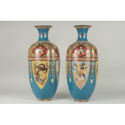 134 - A LARGE PAIR OF LATE 19TH - EARLY 20TH CENTURY JAPANESE CLOISONNE VASES, decorated with panels of st... 