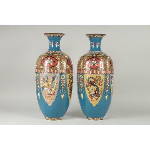 134 - A LARGE PAIR OF LATE 19TH - EARLY 20TH CENTURY JAPANESE CLOISONNE VASES, decorated with panels of st... 