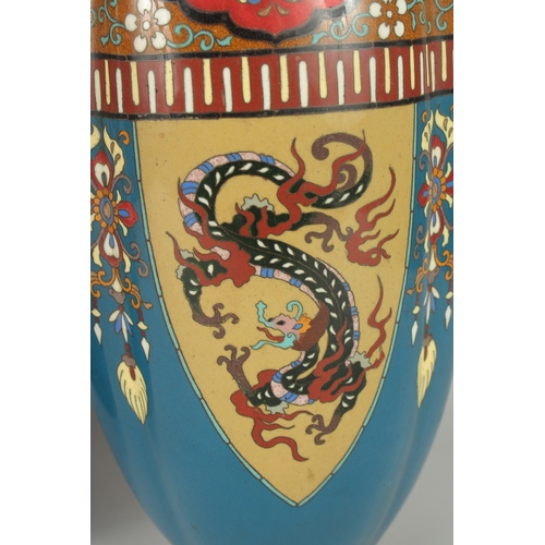 134 - A LARGE PAIR OF LATE 19TH - EARLY 20TH CENTURY JAPANESE CLOISONNE VASES, decorated with panels of st... 