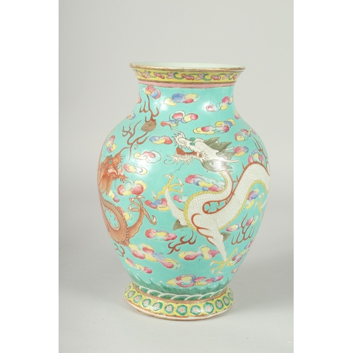 135 - A 19TH CENTURY CHINESE TURQUOISE GROUND FAMILLE ROSE PORCELAIN DRAGON VASE, the body enamel painted ... 