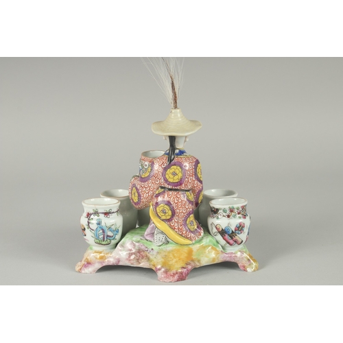 138 - A 19TH CENTURY FAMILLE ROSE PORCELAIN FIGURAL GROUP of a seated vase seller surrounded by six vase-f... 