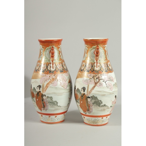 146 - A FINE PAIR OF JAPANESE KUTANI PORCELAIN TWIN HANDLE VASES, painted with a continuous scene depictin... 