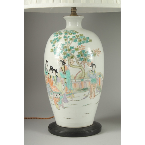 148 - A PAIR OF CHINESE FAMILLE VERTE PORCELAIN VASE LAMPS, painted with female figures beside a tree, bot... 