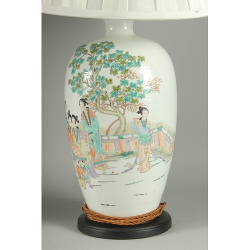 148 - A PAIR OF CHINESE FAMILLE VERTE PORCELAIN VASE LAMPS, painted with female figures beside a tree, bot... 