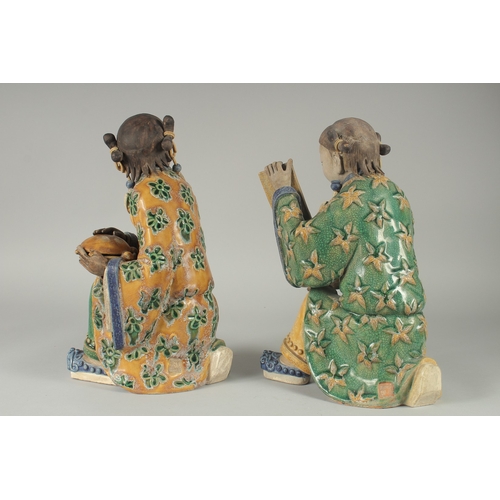 149 - A LARGE PAIR OF 19TH CENTURY CHINESE SANCAI GLAZED POTTERY FIGURES, 33cm high.