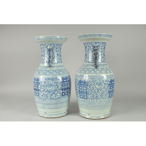 150 - A PAIR OF 19TH CENTURY CHINESE BLUE AND WHITE PORCELAIN VASES, with moulded twin handles in the form... 