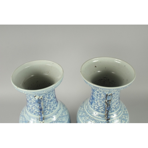 150 - A PAIR OF 19TH CENTURY CHINESE BLUE AND WHITE PORCELAIN VASES, with moulded twin handles in the form... 