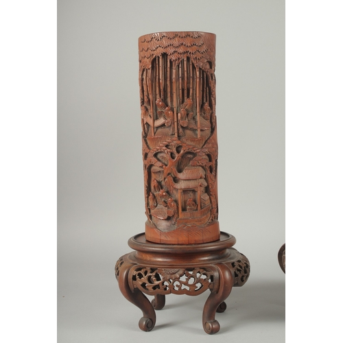 152 - A LARGE PAIR OF 19TH CENTURY CHINESE CARVED BAMBOO VASES, together with carved and pierced hardwood ... 