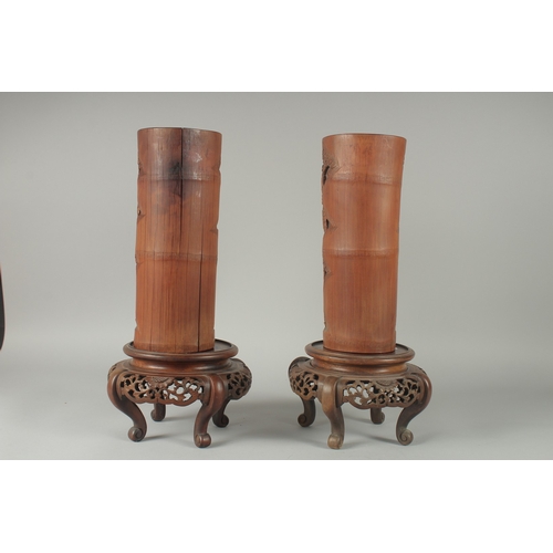 152 - A LARGE PAIR OF 19TH CENTURY CHINESE CARVED BAMBOO VASES, together with carved and pierced hardwood ... 