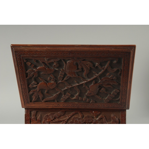 155 - A GOOD CHINESE CARVED WOOD TEA CHEST, carved with various animals including fish, goats, and birds, ... 