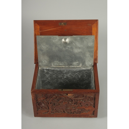 155 - A GOOD CHINESE CARVED WOOD TEA CHEST, carved with various animals including fish, goats, and birds, ... 