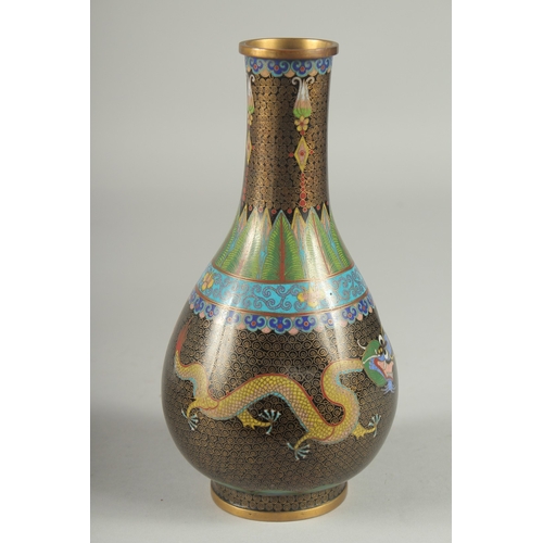 164 - A CHINESE CLOISONNE DRAGON VASE, with two dragon and the flaming pearl of wisdom, 22cm high.