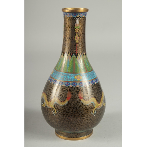 164 - A CHINESE CLOISONNE DRAGON VASE, with two dragon and the flaming pearl of wisdom, 22cm high.