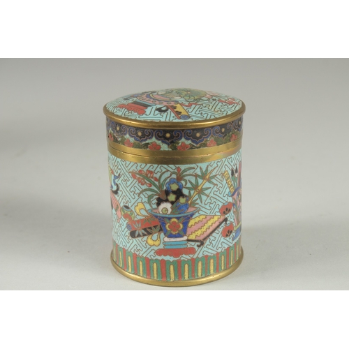 166 - A CHINESE BLUE GROUND CLOISONNE CYLINDRICAL BOX AND COVER, decorated with various objects, the base ... 