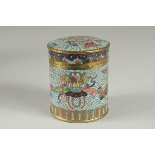 166 - A CHINESE BLUE GROUND CLOISONNE CYLINDRICAL BOX AND COVER, decorated with various objects, the base ... 