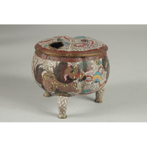 174 - A CHINESE CLOISONNE TRIPOD CENSER AND COVER, decorated with foo dogs and stylised clouds, 10cm high.