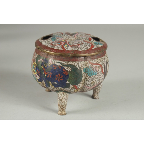 174 - A CHINESE CLOISONNE TRIPOD CENSER AND COVER, decorated with foo dogs and stylised clouds, 10cm high.