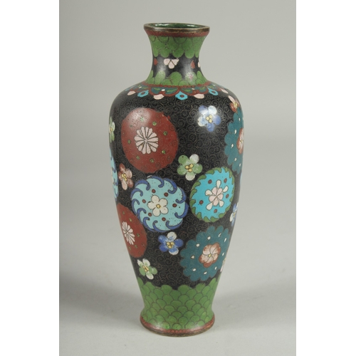 175 - A JAPANESE BLACK GROUND CLOISONNE VASE, with decorative floral roundels and green scale pattern, 21.... 