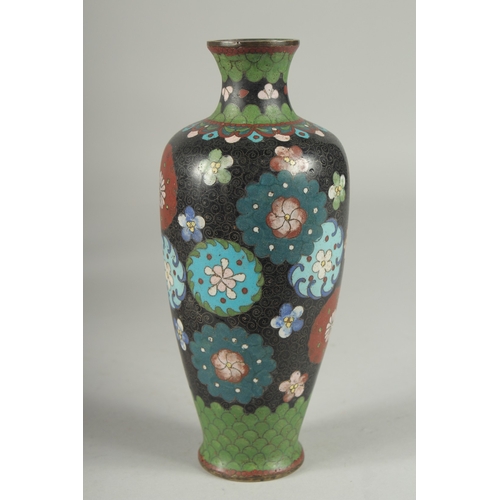 175 - A JAPANESE BLACK GROUND CLOISONNE VASE, with decorative floral roundels and green scale pattern, 21.... 