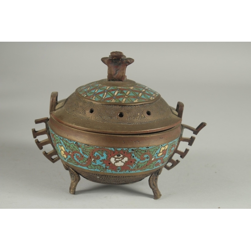 176 - A CHINESE CHAMPLEVE ENAMEL CLOISONNE CENSER AND COVER, raised on tripod legs, 15cm high.