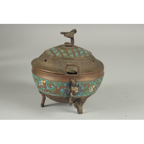 176 - A CHINESE CHAMPLEVE ENAMEL CLOISONNE CENSER AND COVER, raised on tripod legs, 15cm high.