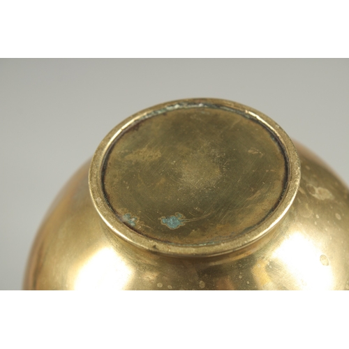 180 - A JAPANESE BRASS JUG, with relief foliate decoration, 23cm high.