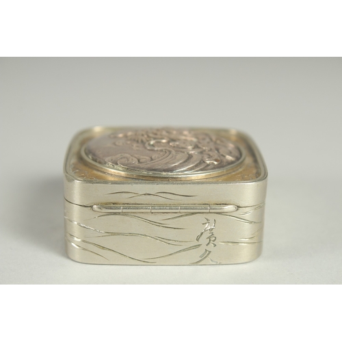 181 - A SMALL SIGNED JAPANESE WHITE METAL AND BRASS BOX, the hinged lid with relief dragon roundel, 5cm sq... 