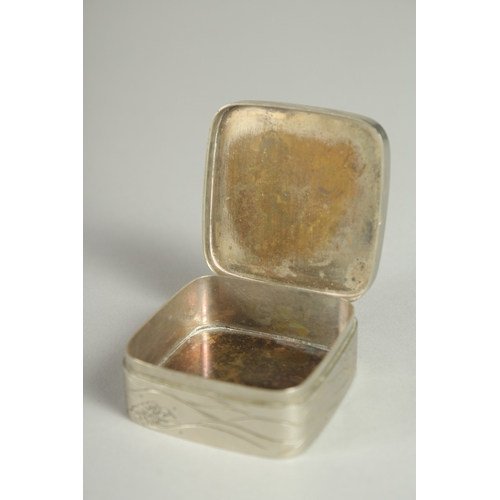 181 - A SMALL SIGNED JAPANESE WHITE METAL AND BRASS BOX, the hinged lid with relief dragon roundel, 5cm sq... 