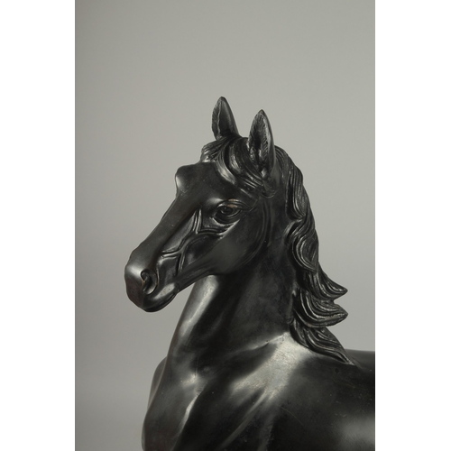 186 - A LARGE JAPANESE TAISHO / SHOWA SIGNED BRONZE HORSE, in a cantering pose, engraved signature to the ... 