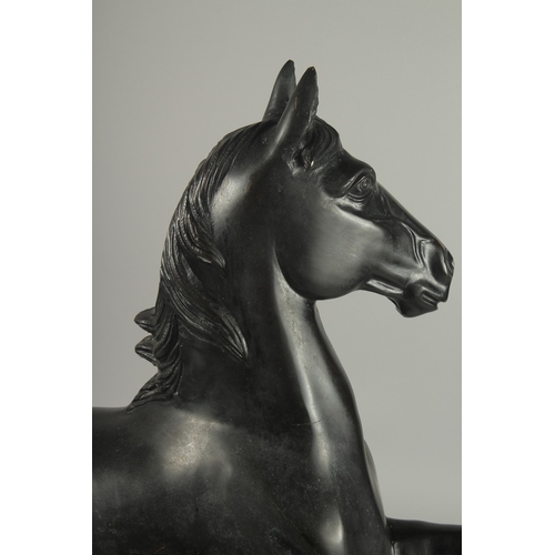 186 - A LARGE JAPANESE TAISHO / SHOWA SIGNED BRONZE HORSE, in a cantering pose, engraved signature to the ... 