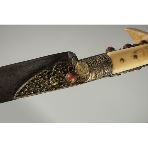 212 - A FINE 19TH CENTURY OTTOMAN TURKISH YATAGHAN SWORD with coral inset walrus handle and silver inlaid ... 