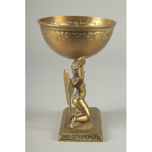 213 - A FINE 19TH CENTURY INDIAN BRASS OFFERING BOWL WITH A GARUDA BASE, 17.5cm high.