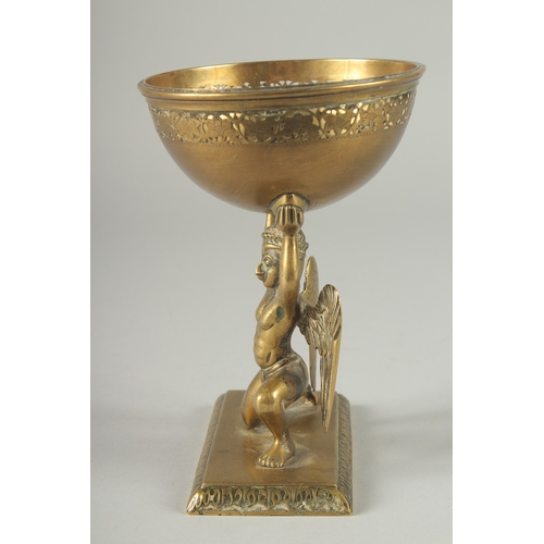 213 - A FINE 19TH CENTURY INDIAN BRASS OFFERING BOWL WITH A GARUDA BASE, 17.5cm high.