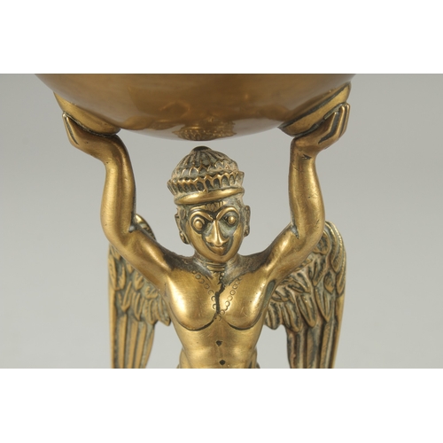 213 - A FINE 19TH CENTURY INDIAN BRASS OFFERING BOWL WITH A GARUDA BASE, 17.5cm high.