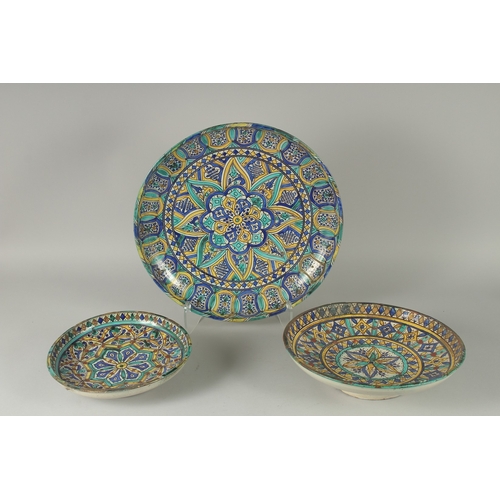 227 - A COLLECTION OF THREE 19TH CENTURY MOROCCAN GLAZED POTTERY CHARGERS, with graduating sizes, 43cm, 34... 