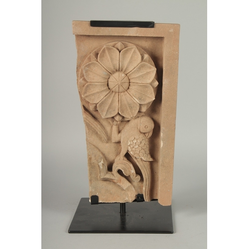 228 - A FINELY CARVED MUGHAL INDIAN STONE PANEL ON A METAL STAND, stone 40cm x 22.5cm.