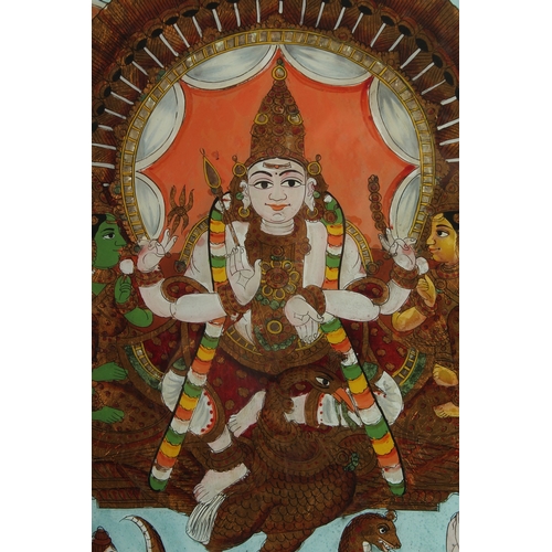 232 - A VERY FINE AND LARGE SOUTH INDIAN TANJORE REVERSE GLASS PAINTING OF A DEITY, inset within a wooden ... 