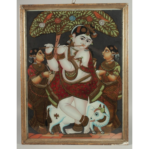 233 - A FINE AND LARGE SOUTH INDIAN TANJORE REVERSE GLASS PAINTING OF FLUTING KRISHNA, inset within a wood... 