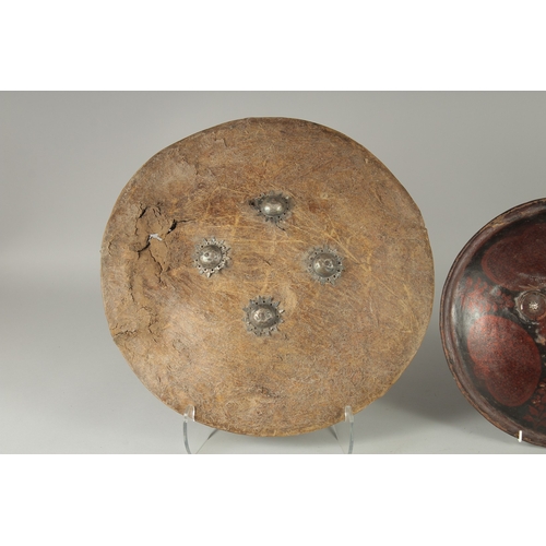 236 - TWO INDIAN SHIELDS, (af), 46cm wide and 34.5cm diameter, (2).