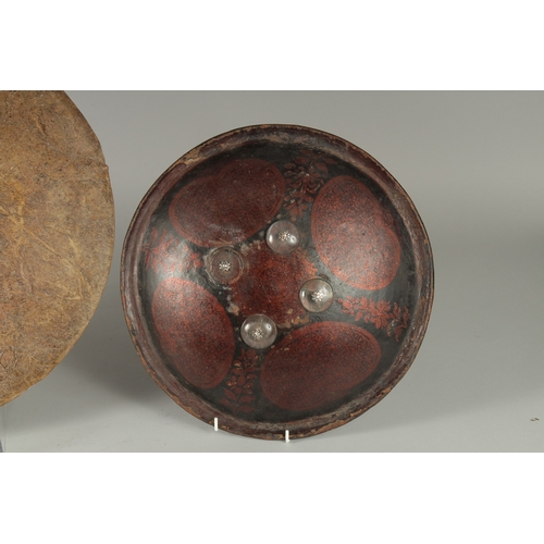 236 - TWO INDIAN SHIELDS, (af), 46cm wide and 34.5cm diameter, (2).