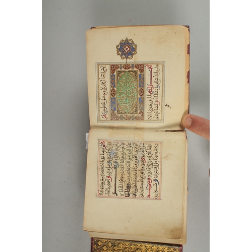 239 - A 19TH CENTURY MOROCCAN LEATHER BOUND ILLUMINATED COLLECTION OF PRAYERS INCLUDING DALA'IL AL-KHAYRAT... 