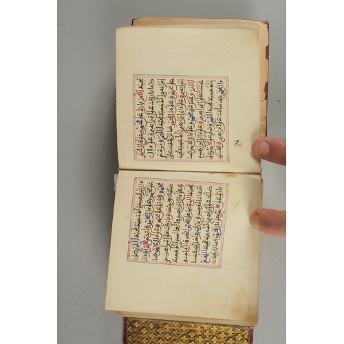 239 - A 19TH CENTURY MOROCCAN LEATHER BOUND ILLUMINATED COLLECTION OF PRAYERS INCLUDING DALA'IL AL-KHAYRAT... 