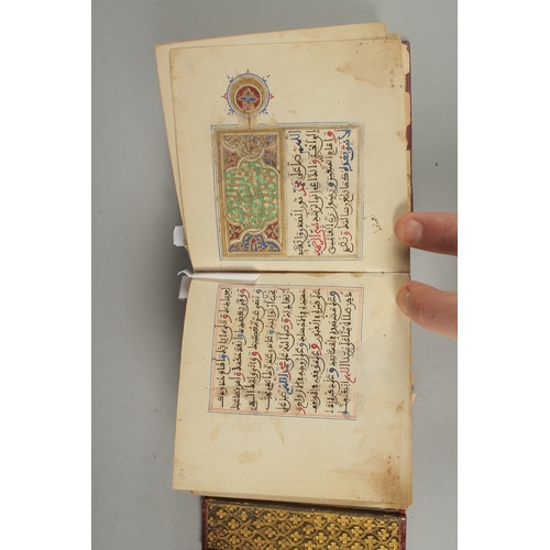 239 - A 19TH CENTURY MOROCCAN LEATHER BOUND ILLUMINATED COLLECTION OF PRAYERS INCLUDING DALA'IL AL-KHAYRAT... 