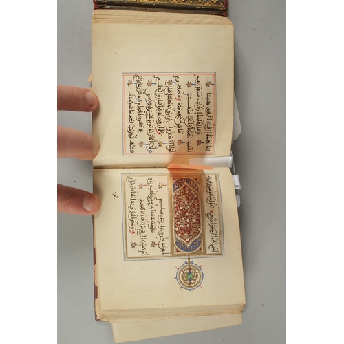 239 - A 19TH CENTURY MOROCCAN LEATHER BOUND ILLUMINATED COLLECTION OF PRAYERS INCLUDING DALA'IL AL-KHAYRAT... 