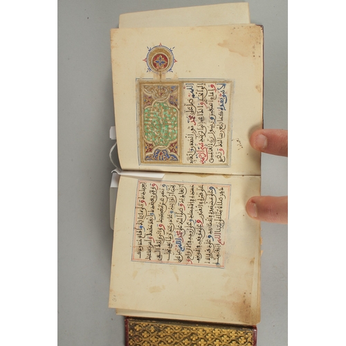 239 - A 19TH CENTURY MOROCCAN LEATHER BOUND ILLUMINATED COLLECTION OF PRAYERS INCLUDING DALA'IL AL-KHAYRAT... 