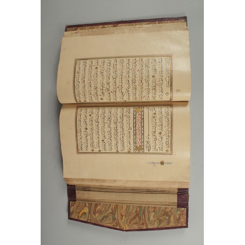 240 - AN 18TH CENTURY OTTOMAN LEATHER BOUND ILLUMINATED QURAN, the manuscript written in naskh in black in... 