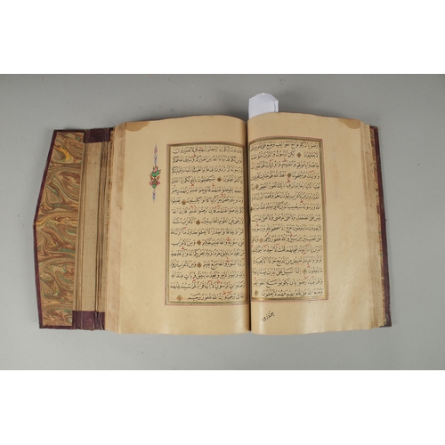 240 - AN 18TH CENTURY OTTOMAN LEATHER BOUND ILLUMINATED QURAN, the manuscript written in naskh in black in... 